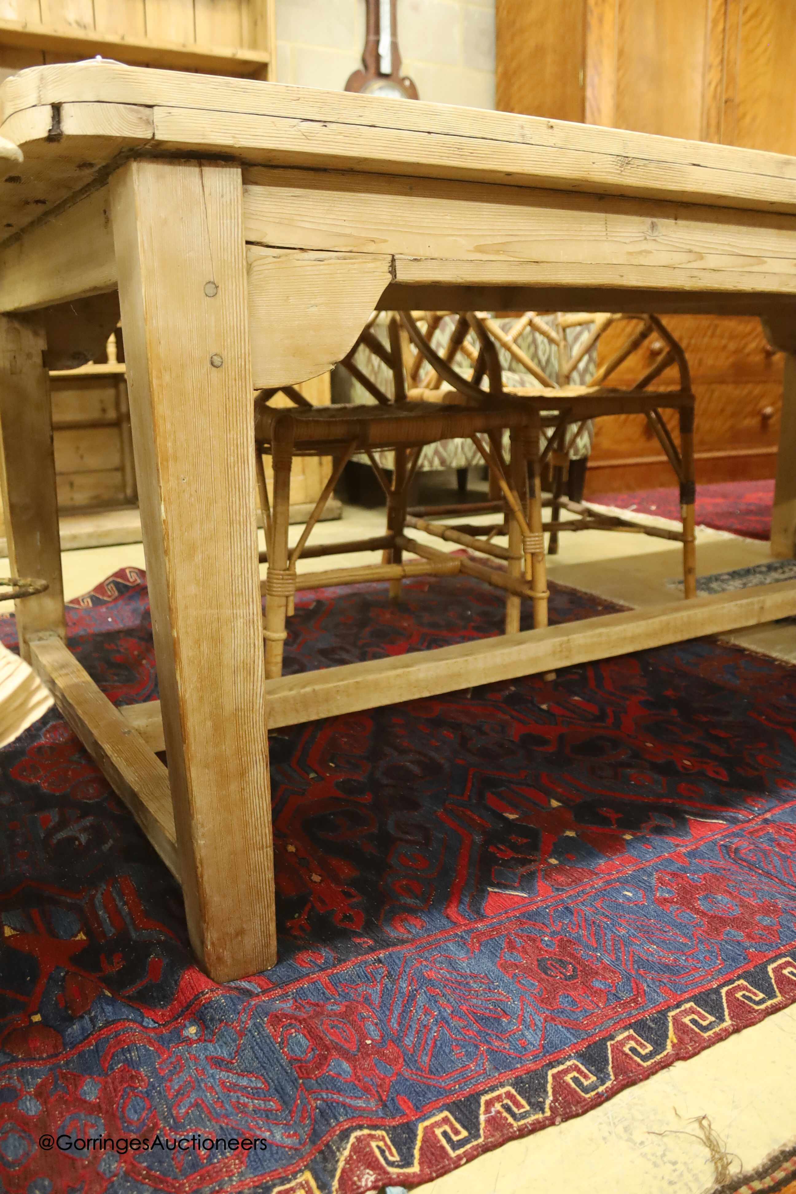 A 19th century rectangular pine plank top farmhouse kitchen table, length 211cm, depth 98cm, height 75cm